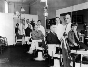 Barbers from front: Jim Casey, Charlie Casey, Jack Casey, fourth unknown. ID's not completely certain.